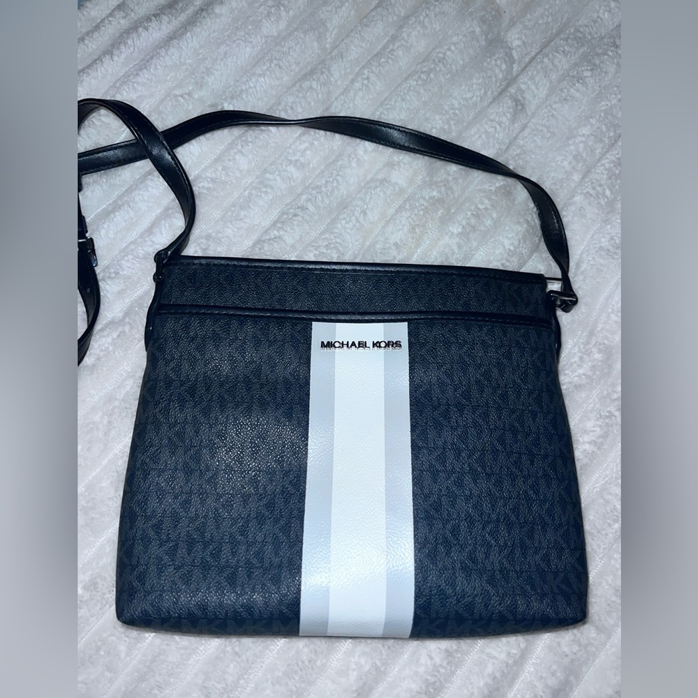 Michale Kors black and white original print cross body bag.
